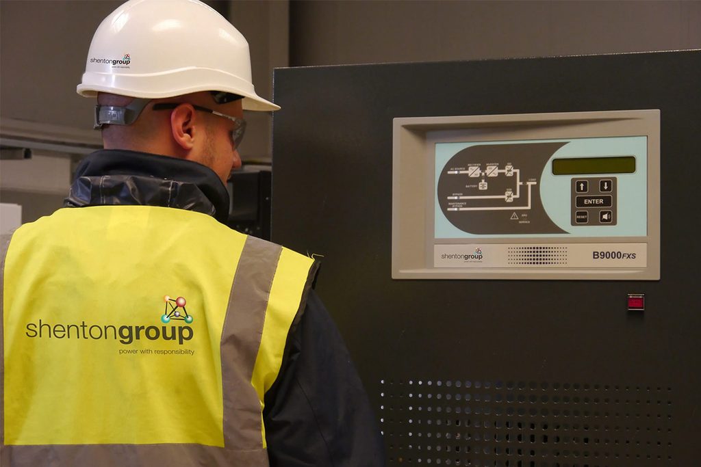 Engineer looking over a UPS