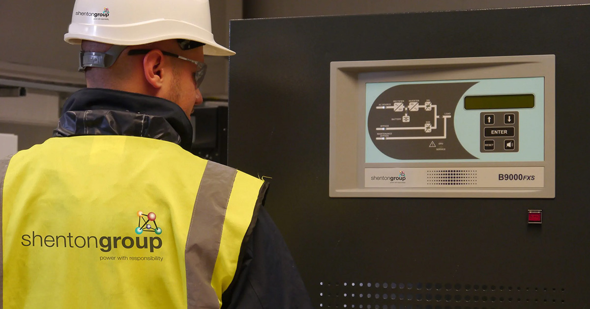 Engineer looking over a UPS